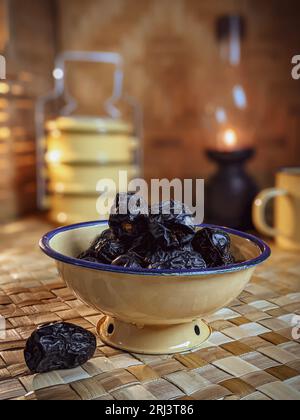 Close-up shot of a bowl containing a selection of dried dates Stock Photo