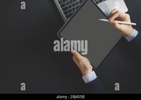 Business man, graphic designer using stylus pen on digital tablet screen, Man in casual ware online working Stock Photo