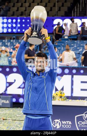 August 20, 2023, Mason, Ohio, USA: Novak Djokovic (SRB) holds up the Rookwood Trophy after winning Sundayâ€™s final round of the Western and Southern Open at the Lindner Family Tennis Center, Mason, Oh. (Credit Image: © Scott Stuart/ZUMA Press Wire) EDITORIAL USAGE ONLY! Not for Commercial USAGE! Stock Photo