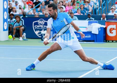 August 20, 2023, Mason, Ohio, USA: Novak Djokovic (SRB) slides into a shot a midcoast during Sundayâ€™s final round of the Western and Southern Open at the Lindner Family Tennis Center, Mason, Oh. (Credit Image: © Scott Stuart/ZUMA Press Wire) EDITORIAL USAGE ONLY! Not for Commercial USAGE! Stock Photo