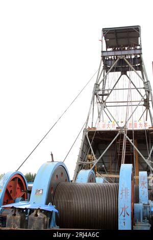 MaCheng July 12: Industrial stage winch for shaft sinking and drilling derrick in MaCheng iron mine on July 12, 2012, Luannan County, Hebei Province, Stock Photo