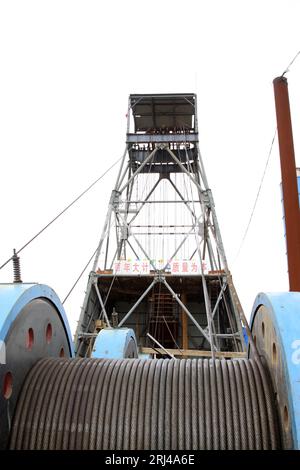 MaCheng July 12: Industrial stage winch for shaft sinking and drilling derrick in MaCheng iron mine on July 12, 2012, Luannan County, Hebei Province, Stock Photo