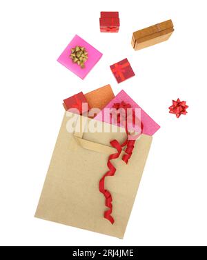 Christmas presents, gift boxes out of a shopping bag isolated on white transparent background Stock Photo