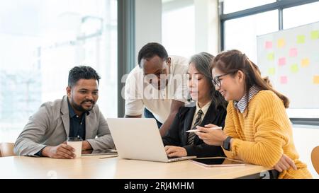 A group of diverse businesspeople or startups is discussing and brainstorming on a new project in the meeting room together. Stock Photo