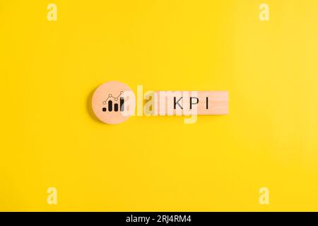 Key performance indicator, Businessman holding wooden cube with KPI Stock Photo