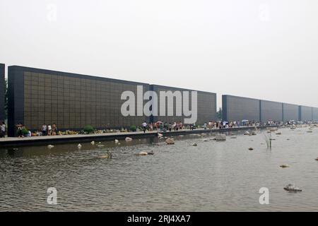 Tangshan City, July 28: People mourning to the name of relatives died in the earthquake, before the Tangshan Earthquake Memorial Wall on July 28, 2012 Stock Photo