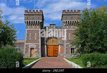 the hague, netherlands -- 2023.08.16: former (old)  gate building (1886)  of the dutch penitentiary complex at scheveningen comprising the icc  detent Stock Photo