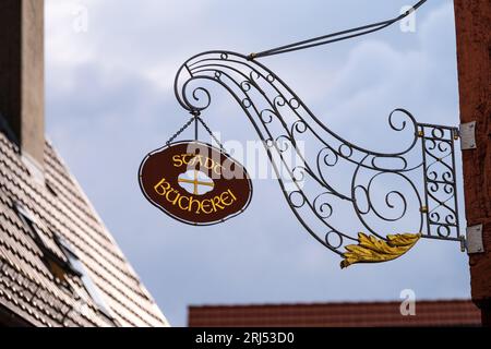 Stadtbuecherei - Old sign of a library on the facade of a half-timbered house in center of Weilheim an der Teck Stock Photo
