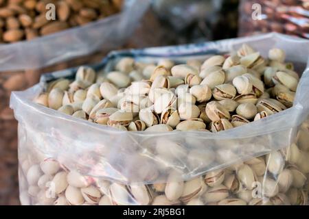 A large sack of pistachios ready to be sold by a vendor at a green market in the city of Tetovo, North Macedonia Stock Photo