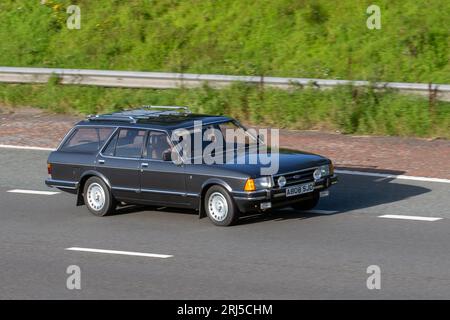 1983 80s eighties Grey Ford Granada Ghia IX Auto, Grey Petrol 2792 cc estate; travelling at speed on the M6 motorway in Greater Manchester, UK Stock Photo