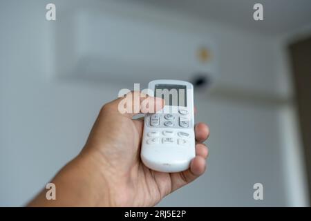 Air condition control by using remote control Stock Photo