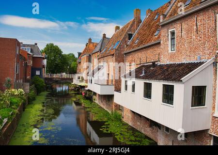 The so-called hanging kitchens of medieval buildings along a canal in the town of Appingedam, province of Groningen, the Netherlands Stock Photo