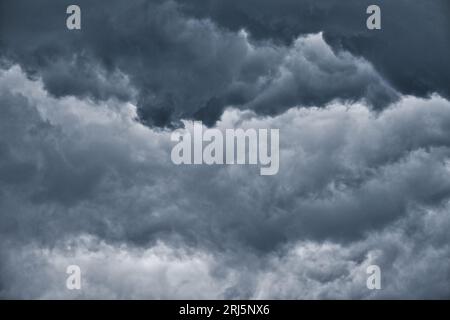 Dark clouds before the rain, used to make a background image. Dramatic sky with dark clouds. Stock Photo