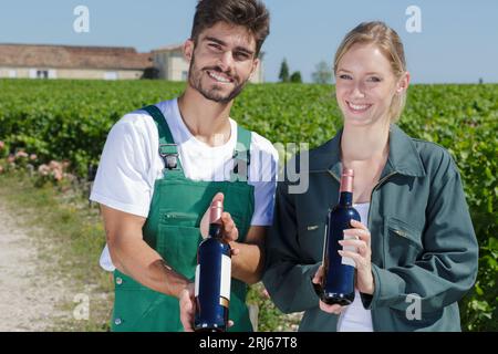 woman and man worker in a vineyard Stock Photo