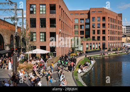 Camden Market Hawley Wharf and people sitting by Regent's Canal, Camden Town, London, England Stock Photo