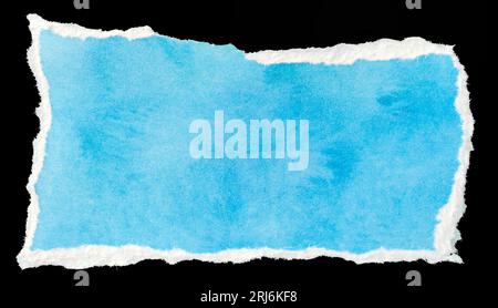 Ripped blue paper note message template isolated on black background Stock Photo