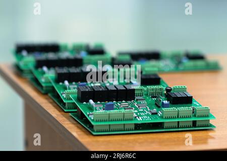 Perm, Russia - June 29, 2023: freshly made printed circuit boards lie on the table close-up Stock Photo