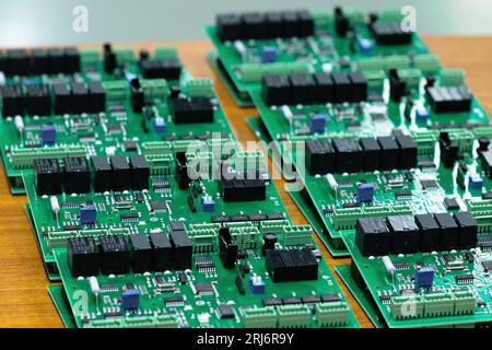 Perm, Russia - June 29, 2023: freshly made printed circuit boards lie on the table close-up Stock Photo