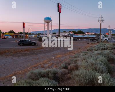 An evening view at Battle Mountain of a tall Water tower against a pink and blue sky, Nevada Stock Photo