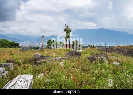 Bronze statue of Daedalus by Igor Mitoraj in the Sanctuary of Venus in the ruins of the ancient city of Pompeii in Campania Region of Southern Italy Stock Photo