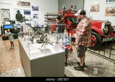 Augusta Georgia,Augusta Museum of History,fire engine firefighting equipment,Hispanic Latin Latino,ethnic ethnicity,immigrant minority,family parent f Stock Photo