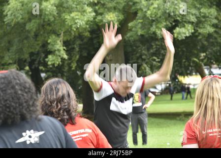 Batala Samba Band in Whitworth Park, Manchester, UK, plus other visitors to the park that afternoon, 19th August, 2023. Stock Photo