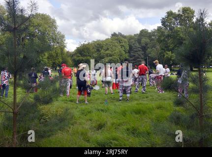 Batala Samba Band in Whitworth Park, Manchester, UK, plus other visitors to the park that afternoon, 19th August, 2023. Stock Photo