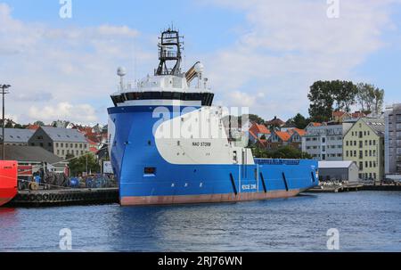 Offshore platform supply vessel Nao Storm (also known as Blue, Aurora, Hermit Storm), Ulstein inverted X-bow hull design tug in Stavanger, Norway Stock Photo