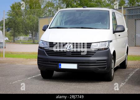 White VW Volkswagen Multivan T6 parked outside at a car dealership, front view. Salo, Finland. August 13, 2023. Stock Photo