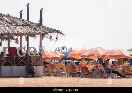 Calangute, Goa, India - January 2023: A tourist restaurant shack with chairs and umbrellas on the beach in North Goa. Stock Photo