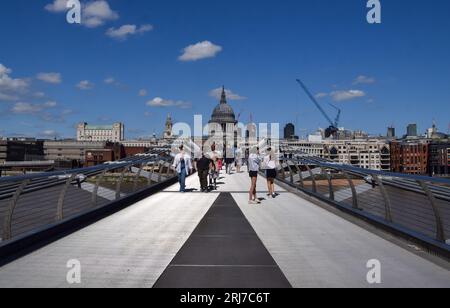 London, UK. 21st August 2023. People walk along Millennium Bridge as sunshine and warm weather return to London after days of wet and cold weather. Credit: Vuk Valcic/Alamy Live News Stock Photo