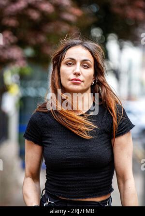 During a photoshoot in Dundee city centre a stunning Spanish woman Beatriz Villacorta poses for the camera in Dundee city centre, Scotland, UK Stock Photo