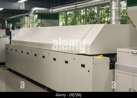 production line for printed circuit board, automatic chip mounter Stock Photo