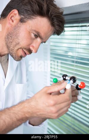focus scientist looking at dna helix in the laboratory Stock Photo