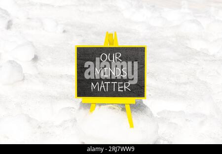 Our minds matter ourmindsmatter symbol. Concept words Our minds matter on beautiful black chalk blackboard. Beautiful snow background. Our minds matte Stock Photo