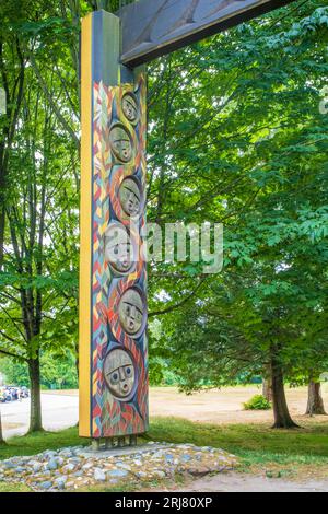 Three red cedar portals are on display at Stanley Park in Vancouver near the First Nations art and totem pole collection at Brockton Point.  Their for Stock Photo