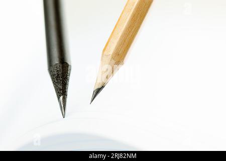 Close Up of dark and light pencils on white paper of notebook. Concept of The National Day of Knowledge, Planning for business meeting or education Stock Photo