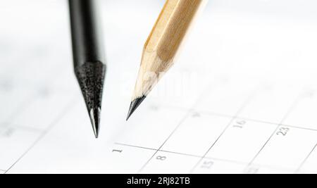 Close Up of dark and light pencils on white paper of calendar. Concept of The National Day of Knowledge, Planning for business meeting or education Stock Photo