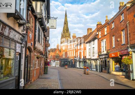 A view at sunrise of St Mary's Church spire from Tamworth Street in the centre of this ancient and historic city in Staffordshire, UK. Stock Photo