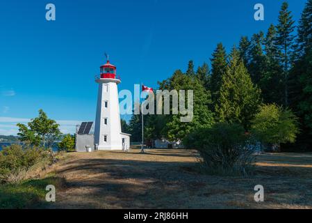 Lighthouse of Cape Mudge town by the Discovery Passage, Quadra Island, British Columbia, Canada. Stock Photo