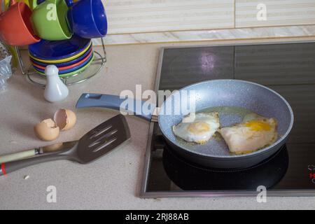 On the electric cooker cooked eggs for breakfast Stock Photo