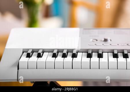 Modern synthesizer in room, closeup Stock Photo