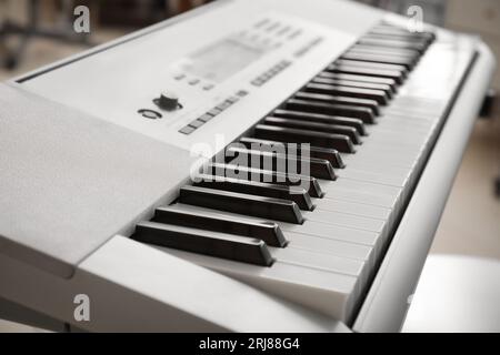 Modern synthesizer in room, closeup Stock Photo