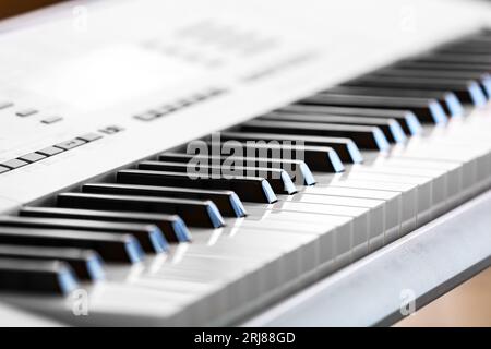 Modern synthesizer in room, closeup Stock Photo