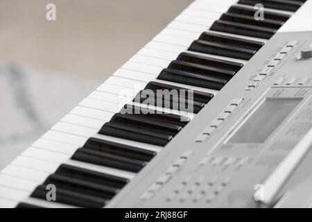 Modern synthesizer in room, closeup Stock Photo