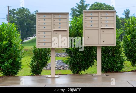 Horizontal shot of two mail boxes holders on stands side by side for a small community. Stock Photo
