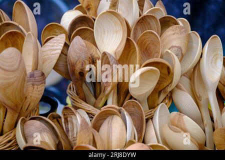lot of hand made wooden kitchen utensils, Wooden spoons, spatulas sold on the street market Stock Photo