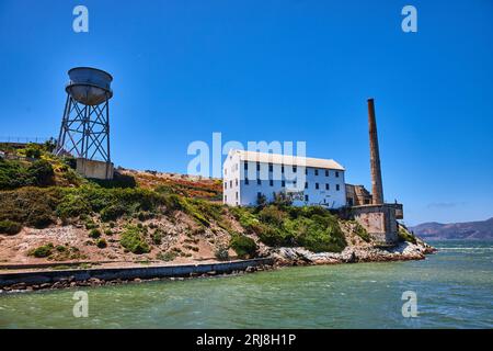 Close up view of Alcatraz Island East side with water tower and white building with Indian Land Stock Photo