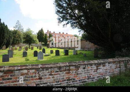 View to manor house from St Botolph's churchyard, Bradenham, Buckinghamshire Stock Photo