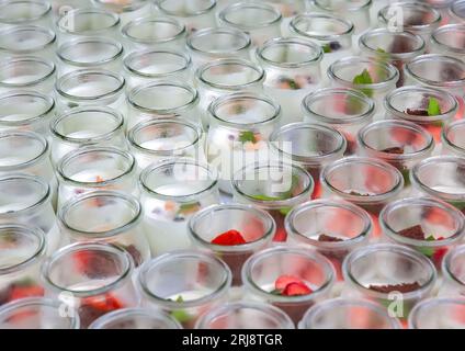 A variety of glass jars containing a range of fresh fruits. Stock Photo